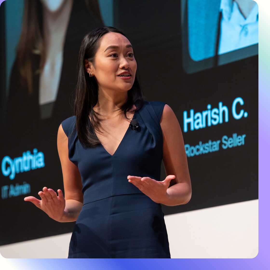 Woman in navy blue dress speaking at Oktane