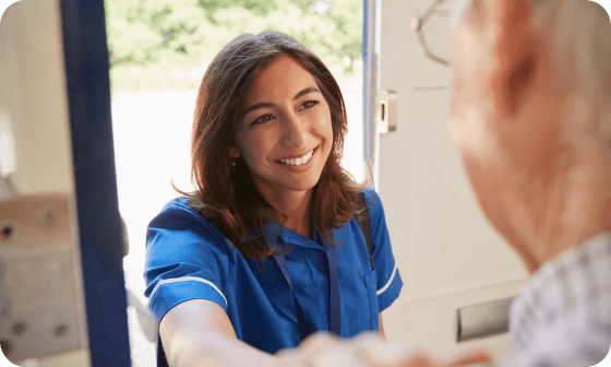 Nurse greeting man at door