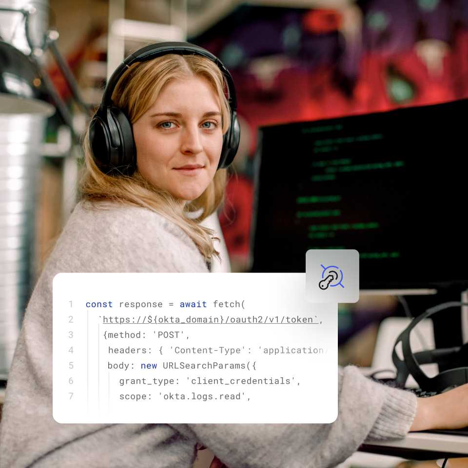 Image of code overlaying image of woman with headphones at computer