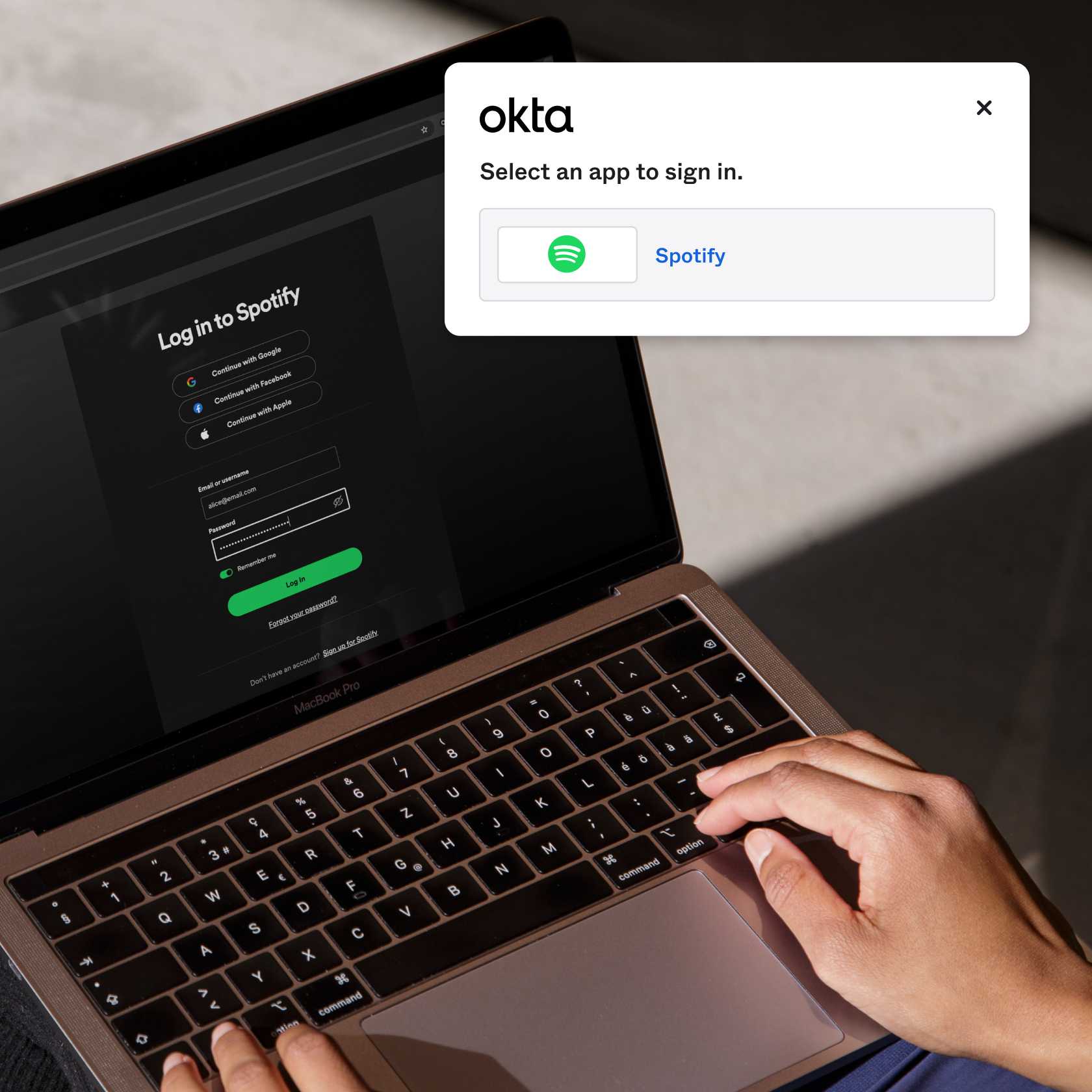 Image of hands logging into Spotify on a laptop overlaid by screenshot displaying how to save the app in Okta Personal