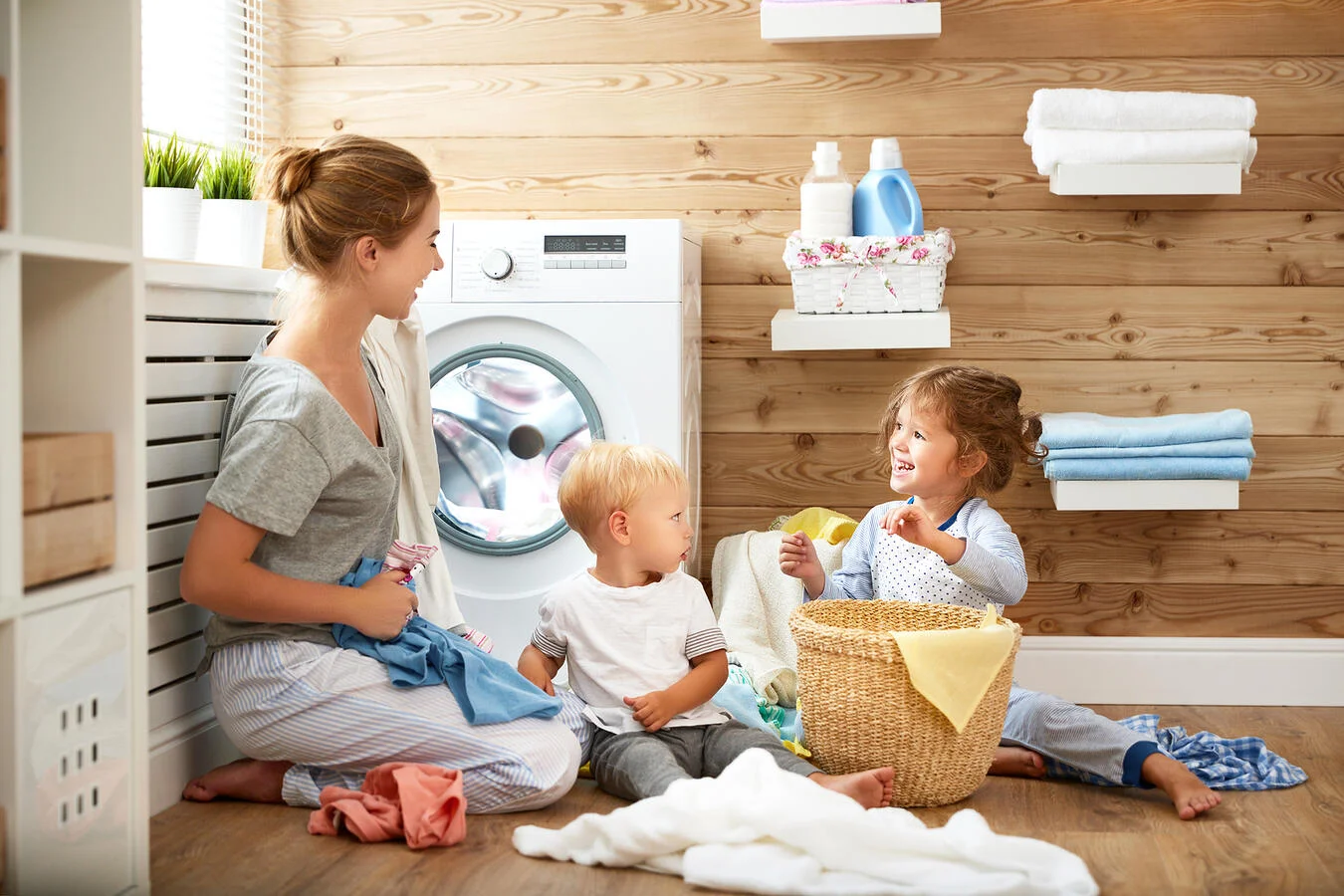 Image with a family sharing a moment in the laundry space.