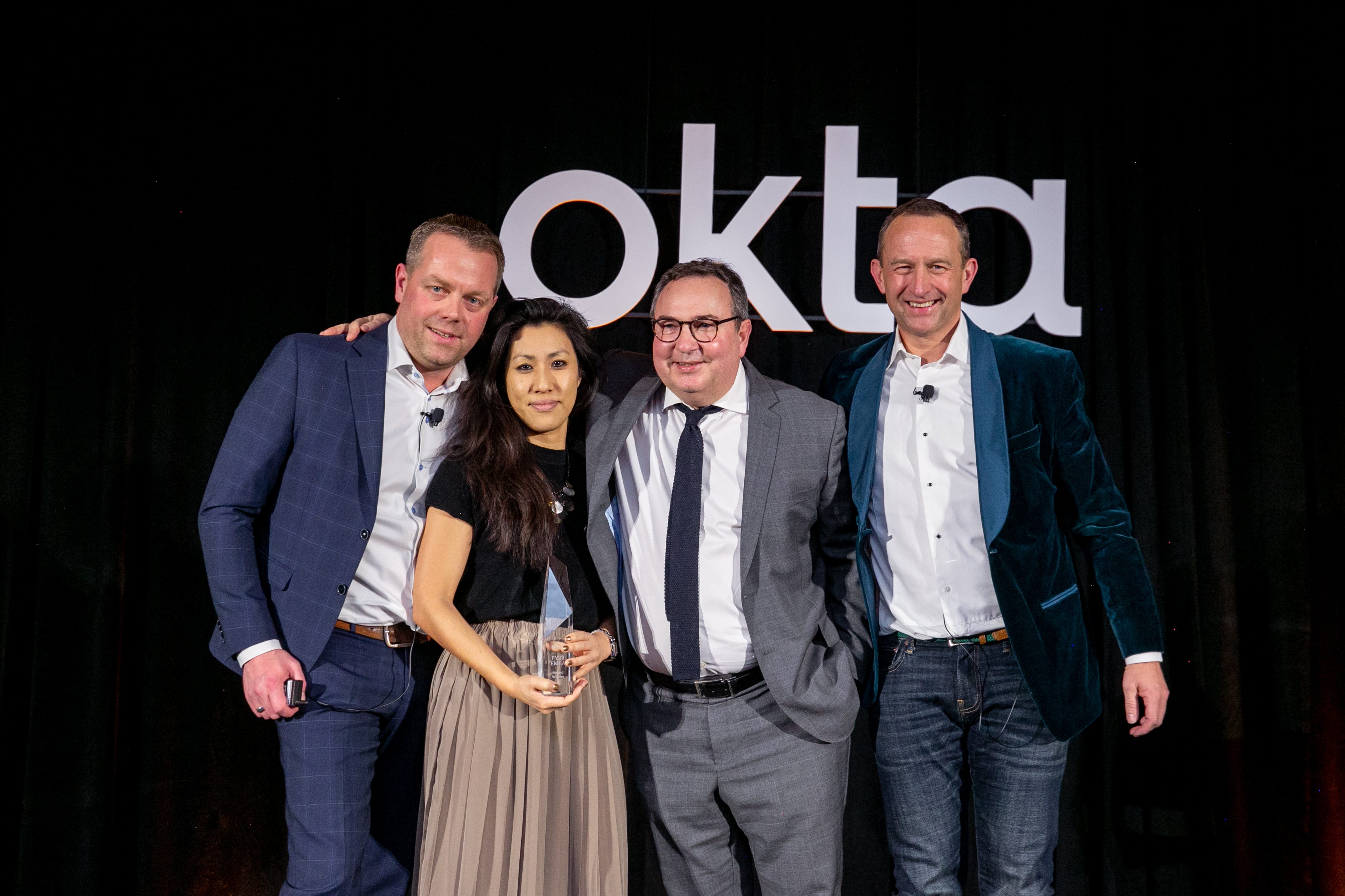 Thevie Chea proudly holds her award at SKO