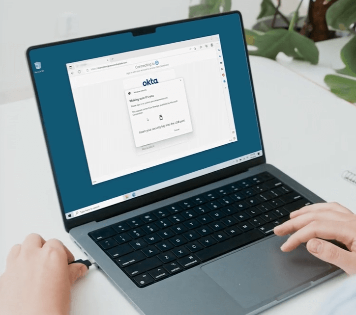 Image of a laptop with Okta on the screen
